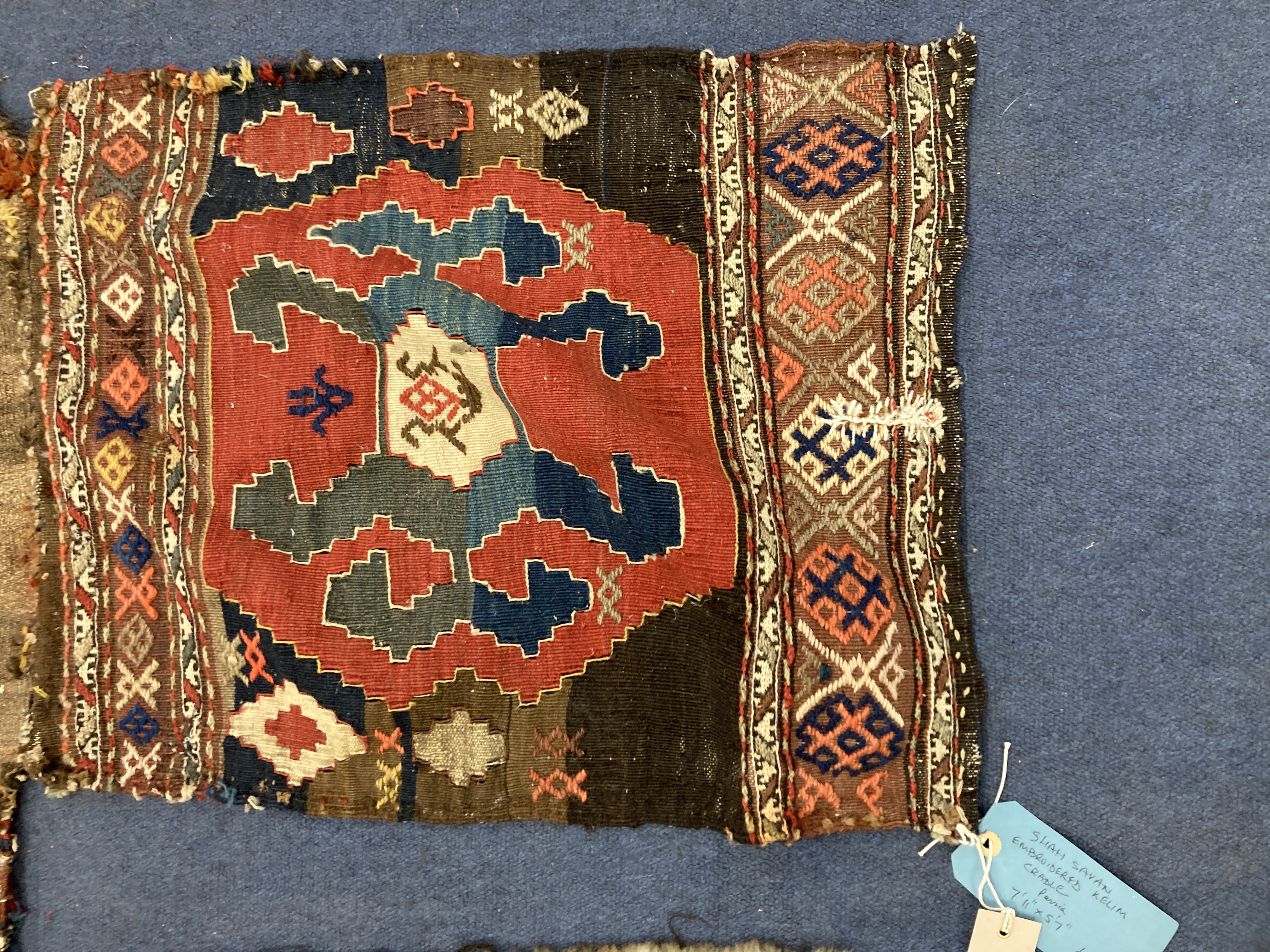 A Shah Savan embroidered Kelim cradle, 176 x 170cm and a small bag face rug, 49 x 54cm